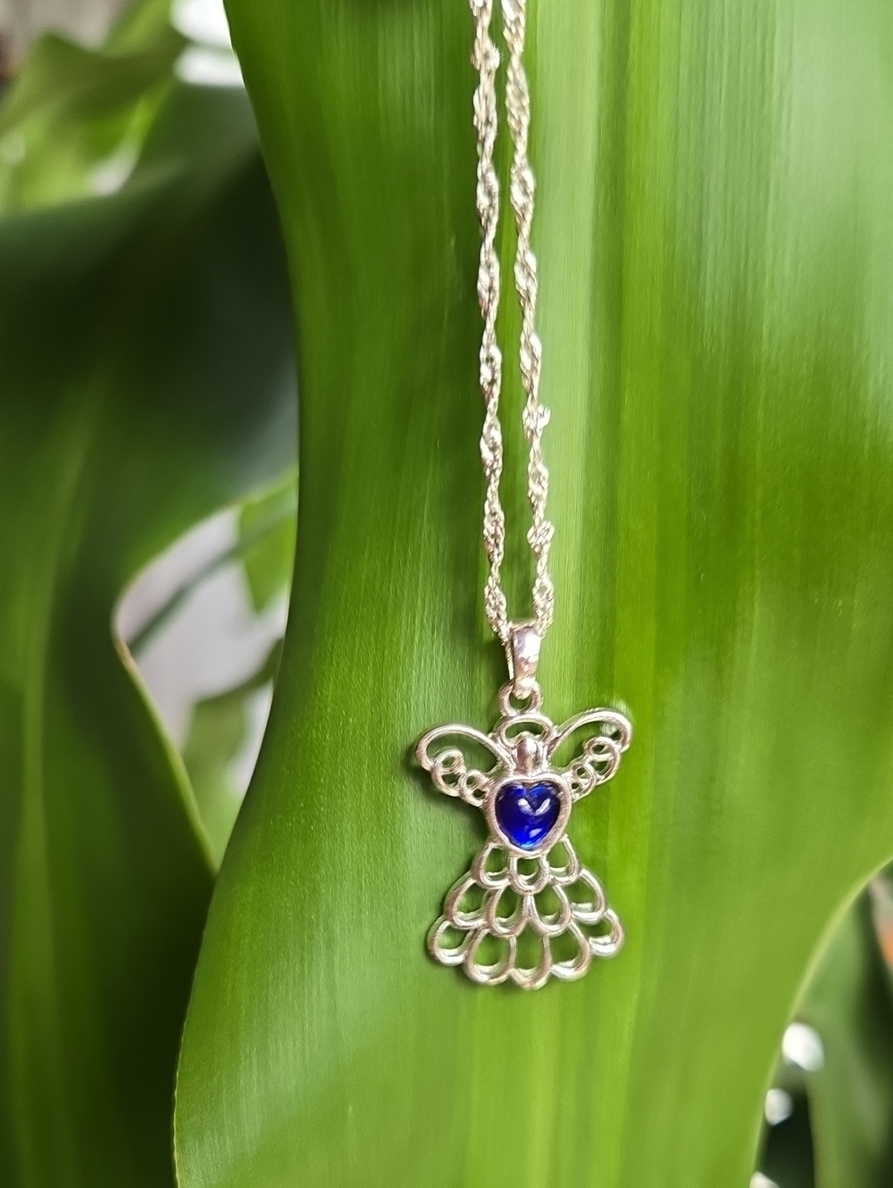 Silver Angel Pendant Necklace with Blue Heart Accent